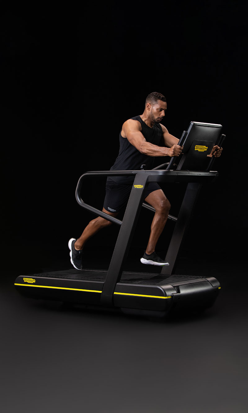 Person using the Skillrun in sled push mode by Technogym